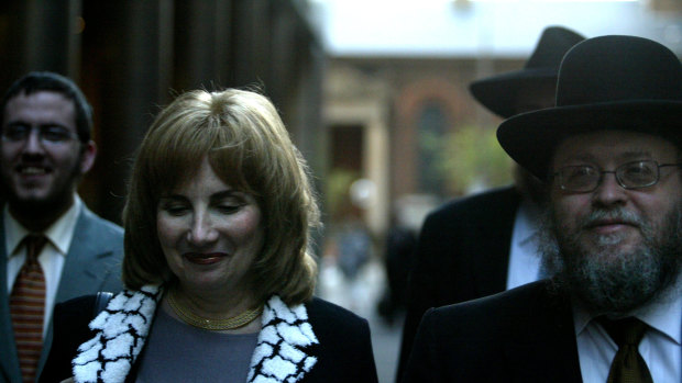 Pnina Feldman leaving a separate court case with her husband Rabbi Pinchus Feldman that also featured her brother Joseph Gutnick as a defendant. 