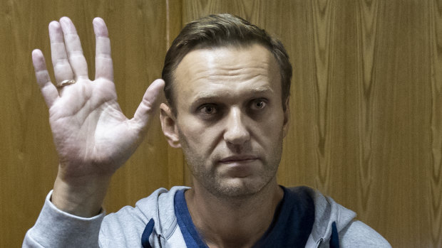 Russian opposition leader Alexei Navalny gestures in a court room in Moscow.