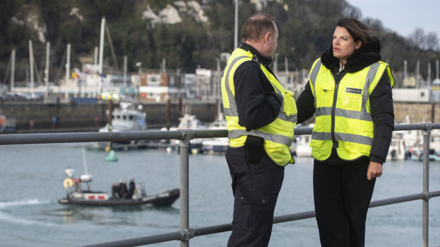 Britain's Immigration Minister Caroline Nokes talks to a Border Force officer in Dover on the weekend.
