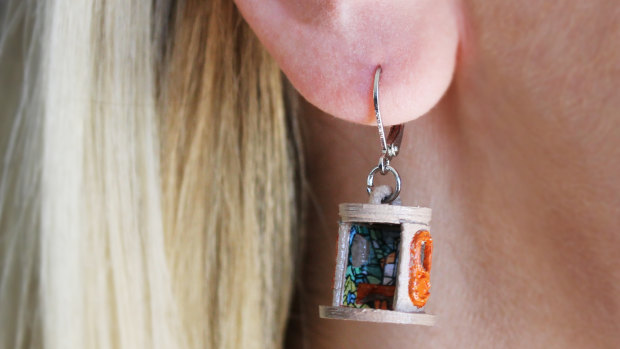 The earrings even feature tiny graffiti walls on the inside.