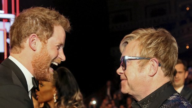 Prince Harry greets Elton John after the Royal Variety Performance at the Albert Hall in London in 2015.