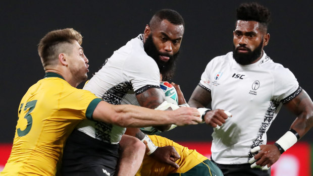 Setting a benchmark: James O'Connor throws himself into contact against Fiji's former NRL star  Semi Radradra at Sapporo Dome.