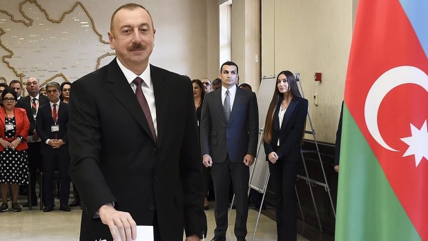 Azerbaijan President Ilham Aliyev casts his ballot at a polling station on April 11. 