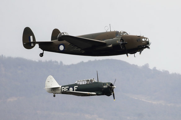 A Lockheed Hudson bomber (foreground) and a CA-16 Wirraway fly over Canberra during commemorations for the 75th anniversary of the end of World War II in Canberra last year.