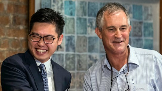 The Financial Times Asia news editor, Victor Mallet, right, shakes hands with Andy Chan, founder of the Hong Kong National Party, at the Foreign Correspondents Club in Hong Kong. 