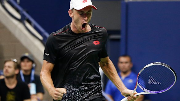 Giant-killer: John Millman reacts after winning a point against Roger Federer.