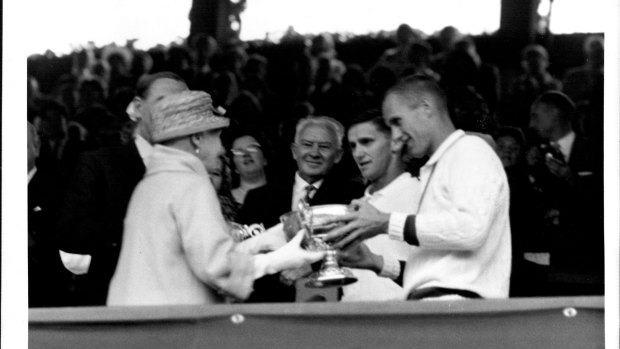 The Countess of Athlone presents the trophy to Roy Emerson and Neale Fraser, after their win in the men’s doubles at Wimbledon.