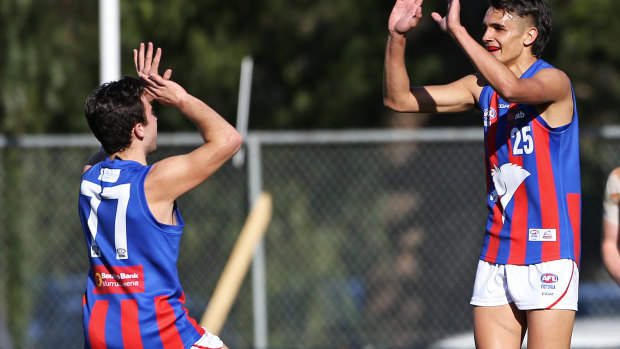 Exciting NGA prospect Jamarra Ugle-Hagan (right) is tied to the Western Bulldogs.  