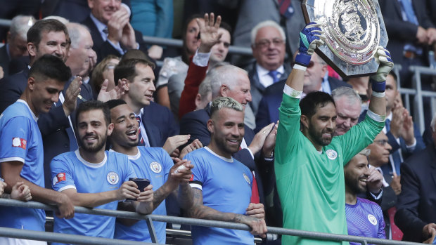 Bragging rights: Manchester City's goalkeeper Claudio Bravo holds up the Community Shield trophy.