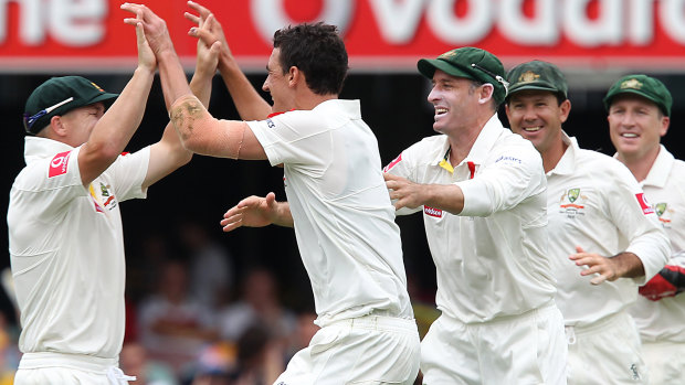 David Warner and Mitchell Starc celebrate the wicket of New Zealand’s Brendon McCullum at the Gabba in 2011. 