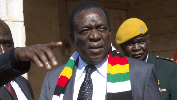 Zimbabwean President Emmerson Mnangagwa leaves the polling station after casting his vote in Kwekwe.