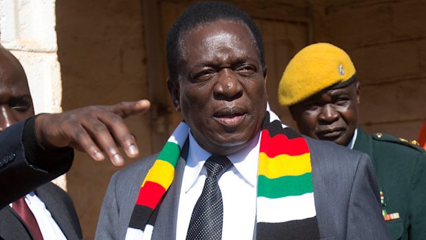 Zimbabwean President Emmerson Mnangagwa leaves the polling station after casting his vote in Kwekwe.