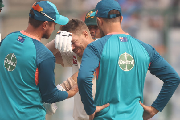David Warner receives medical treatment during his Delhi innings.