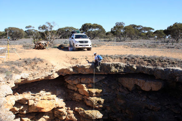 Dr Milo Barham abseils into Murra-El-Elevyn cave on the Nullarbor Plain.