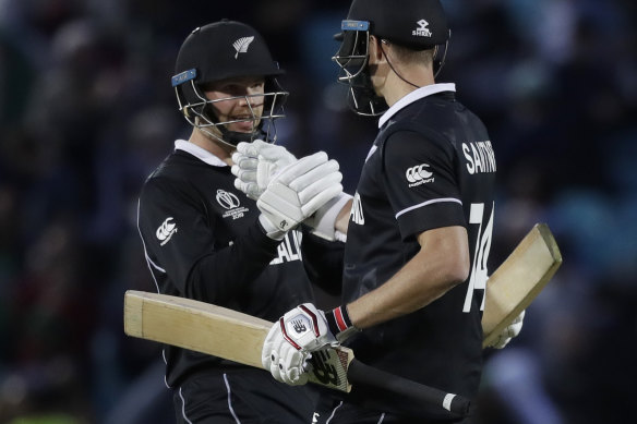 NZ duo Mitchell Santner (right) and Lockie Ferguson celebrate their win over Bangladesh.
