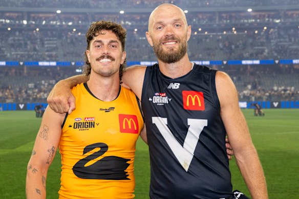 Luke Jackson and Max Gawn pose for a photo post match.