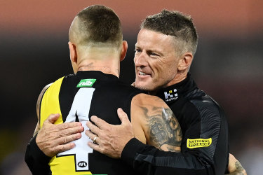 Damien Hardwick embraces Dustin Martin after the grand final in 2020.