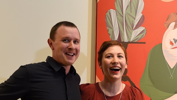 Mitch Cairns in 2017 with his Archibald-winning portrait of wife and artist Agatha Gothe-Snape.