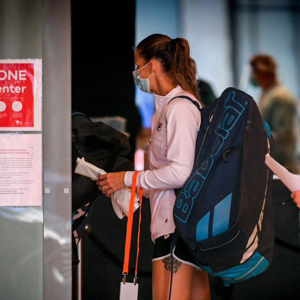 Tennis players who are not in hard quarantine leave the Grand Hyatt in Melbourne for training on January 20.