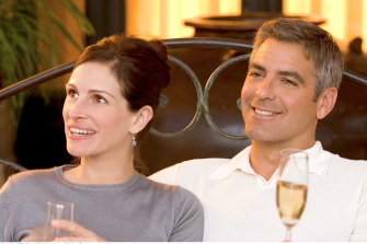 Julia Roberts and George Clooney, pictured here in Ocean’s Twelve, are shooting a romantic comedy in Queensland.