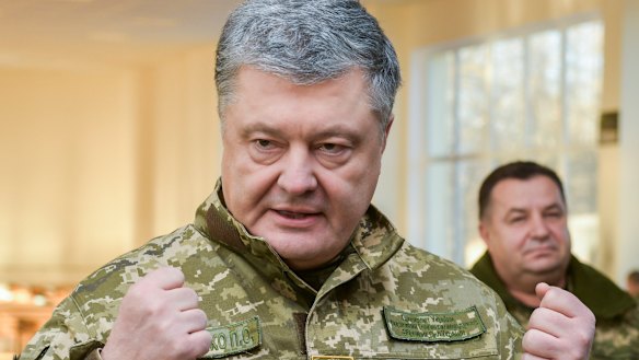 Ukrainian President Petro Poroshenko speak to soldiers during a visit to a military base in Chernihiv on Wednesday.