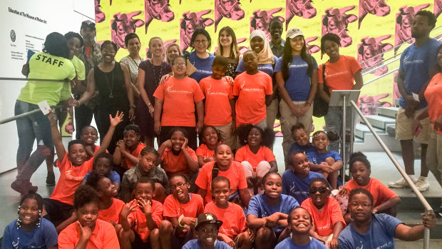 Sheri Yan (centre, back row) at New York's Museum of Modern Art with the charity Children of Promise, of which she is executive director.