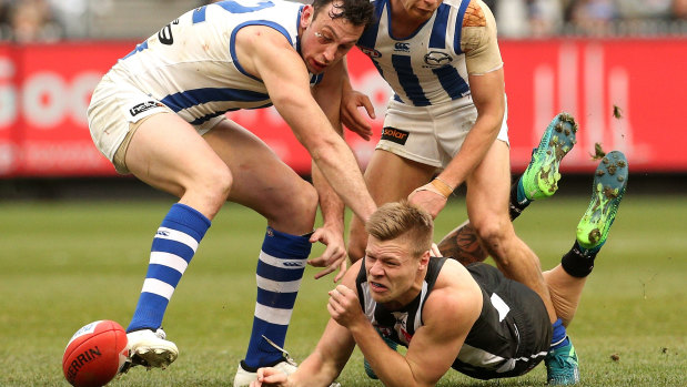 Jordan De Goey handballs under pressure.