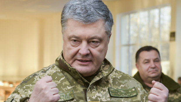 Ukrainian President Petro Poroshenko speak to soldiers during a visit to a military base in Chernihiv on Wednesday.