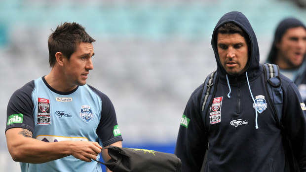Mitchell Pearce (left) and Trent Barrett arrive for NSW training.