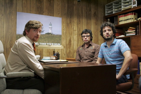Darby with Bret McKenzie and Jemaine Clement in <i>Flight of the Conchords</i>.