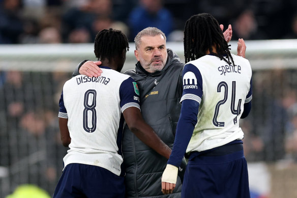 Ange Postecoglou celebrates with his players.