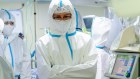 Medics observe a patient with the coronavirus at a hospital in Moscow. 