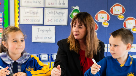 Teacher Michelle Looker with students Savannah Brock, 6, and Jasper Douglas,7