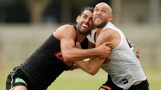 Brodie Grundy with teammate Ben Reid at Collingwood training.