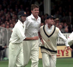 Australia’s Glenn McGrath, center, celebrates with teammates Gregg Blewett, left, and Michael Bevan, right, at Lord’s on June 20, 1997.