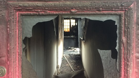 View of Melanie Sandford's home gutted by fire through the front door.
