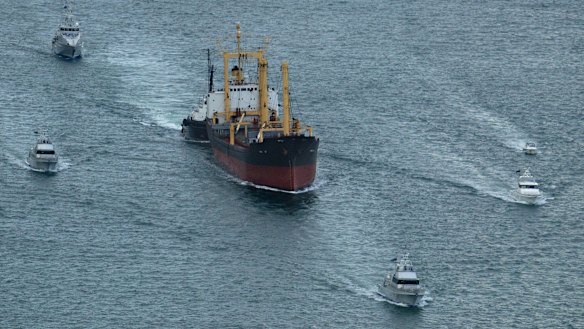 The Pong Su under arrest heading into Sydney, flanked by Police and Customs craft.