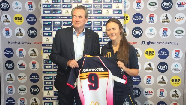 The ACT Brumbies scrumhalf Jane Garraway with ActewAGL marketing director Paul Walshe earlier this year. ActewAGL has been a big sponsor of sport on all levels in Canberra.