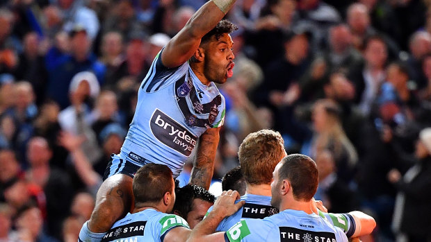 Josh Addo-Carr leads the celebrations after the Blues' last-gasp win.