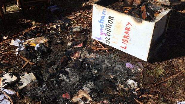 The remains of the Lyneham and O'Connor Little Library after vandals set fire to it.