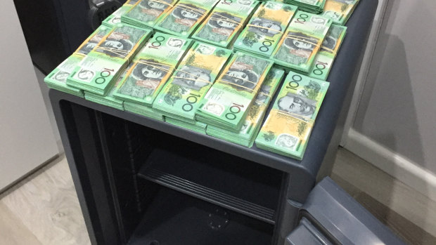 Cash seized during raids on Assure Protection Services.