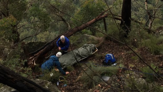 Paramedics tend to a German tourist who fell off a cliff in the Blue Mountains.