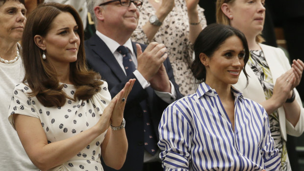 Kate, Duchess of Cambridge and Meghan, Duchess of Sussex, right, applaud after Novak Djokovic of Serbia defeated Rafael Nadal of Spain in the men's singles semifinal match.