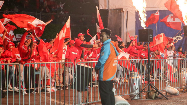 Burning passion: Fans at Mt Smart Stadium celebrate a try to Tonga's Daniel Tupou.