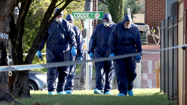 Forensic police officers inspect a property in Bedford. Five bodies were discovered at the home with homicide squad detectives investigating.