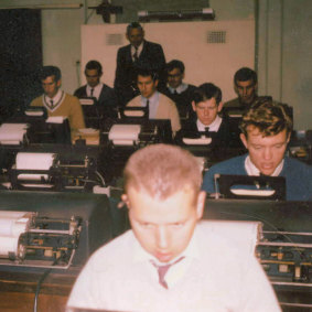Greg Archer, in the blue jumper, at postal training school in 1966.
