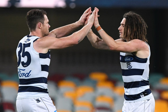 Gryan Miers and Patrick Dangerfield celebrate a goal.