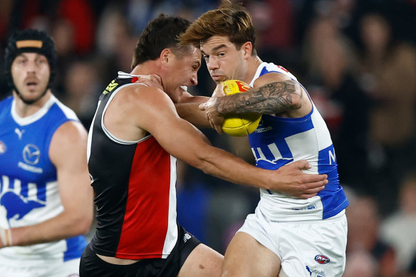 Jy Simpkin of the Kangaroos is tackled by Rowan Marshall of the Saints.