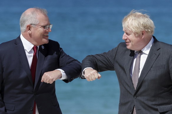 Britain’s Prime Minister Boris Johnson greets Australian Prime Minister Scott Morrison during an official welcome at the G7 summit in Carbis Bay, Cornwall.