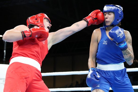 Australian boxing team captain Caitlin Parker (in red) fears the great gains made in women’s boxing would be lost if the sport is dropped.